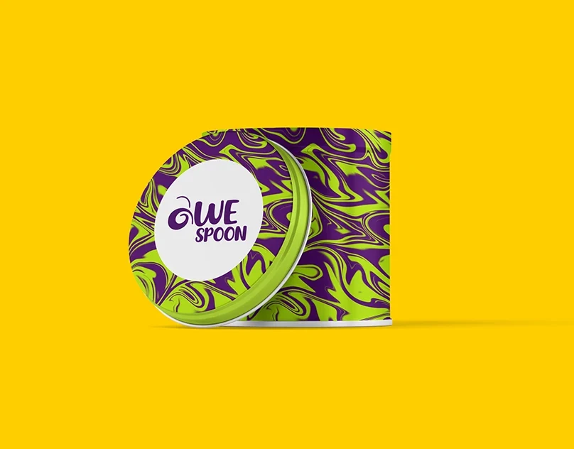 Awespoon Desserts packaging with vibrant illustrated pattern on a bright yellow background