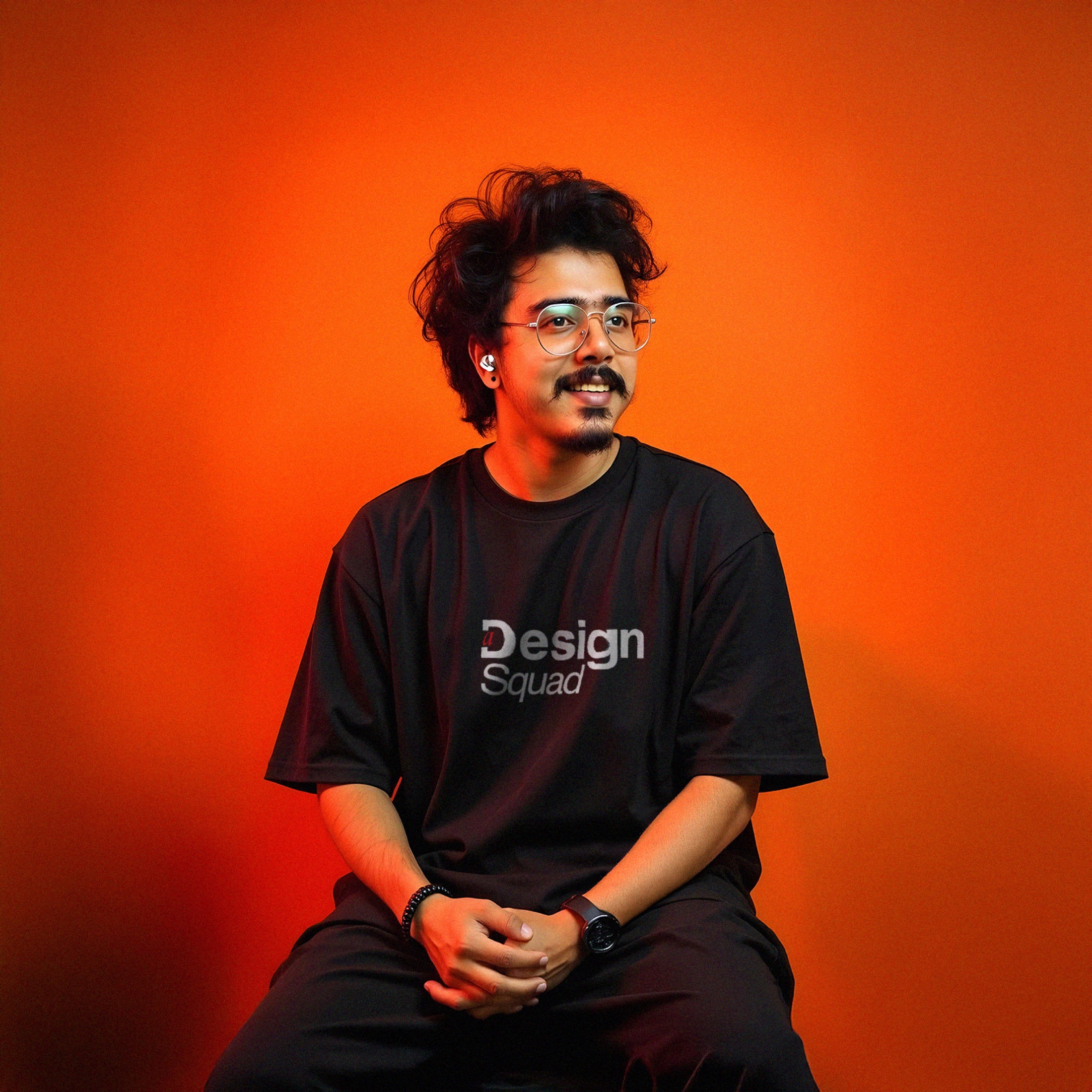 Portrait of Sreerag C against a vivid orange background